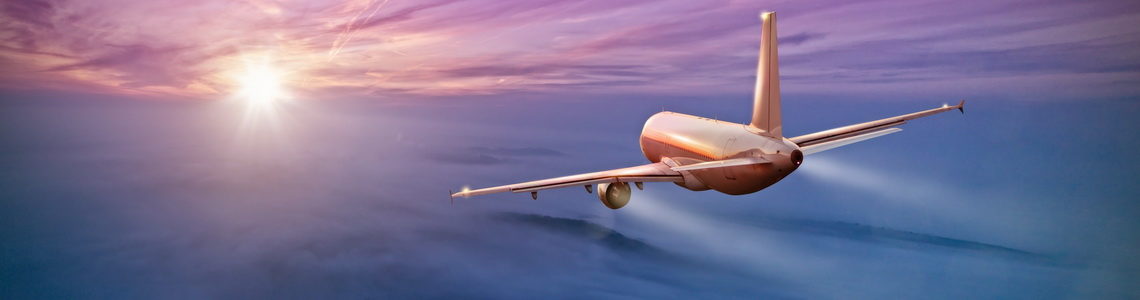 Commercial airplane flying above clouds