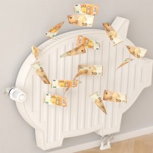 Energy Crisis concept: Saving heating energy by reducing room temperatur.  A radiator in the form of a piggy bank - 50 Euro banknotes falling down with slight motion blur.