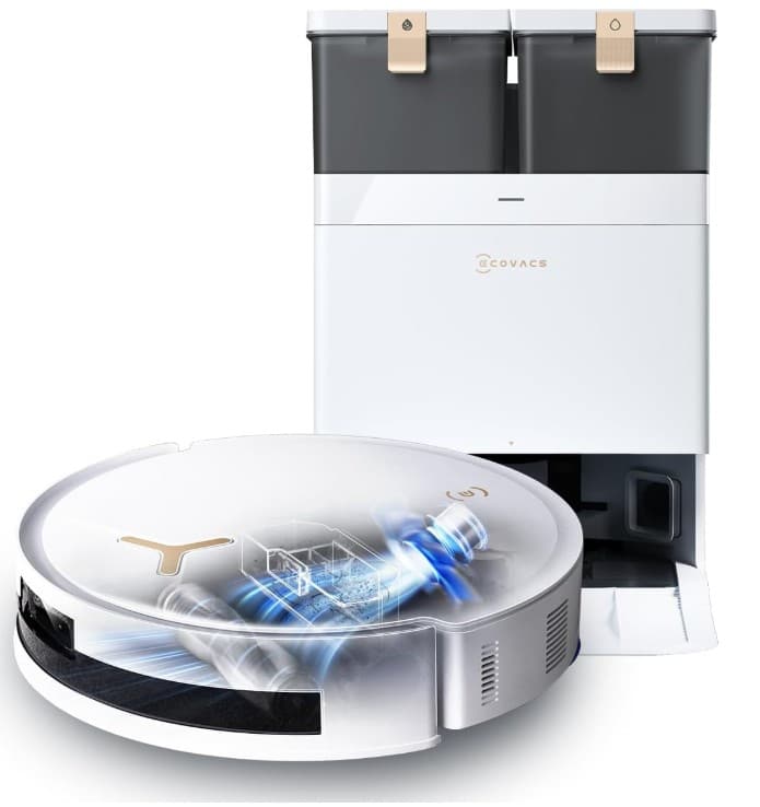 Saugroboter, dessen Inneres man sieht, vor seiner Station. Ecovacs Deebot T50 Max Pro Omni.