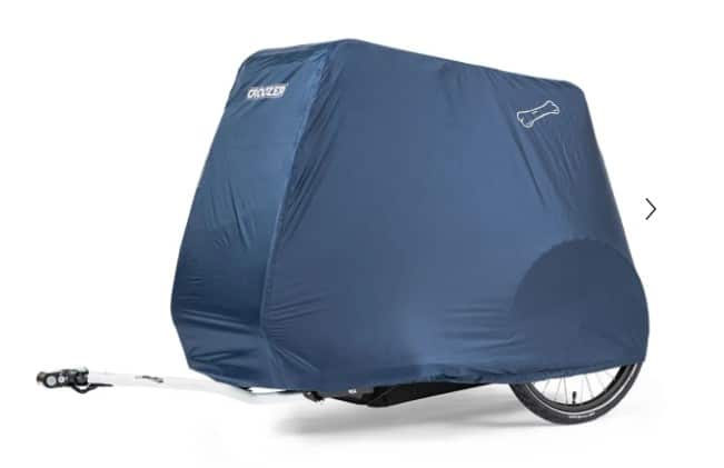 Faltgarage für Fahrradanhänger in Blau, speziell für den Croozer Dog Peppa, die das Fahrzeug vollständig abdeckt und vor Witterungseinflüssen schützt.