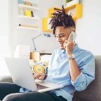 de-man-on-phone-and-laptop-900×900